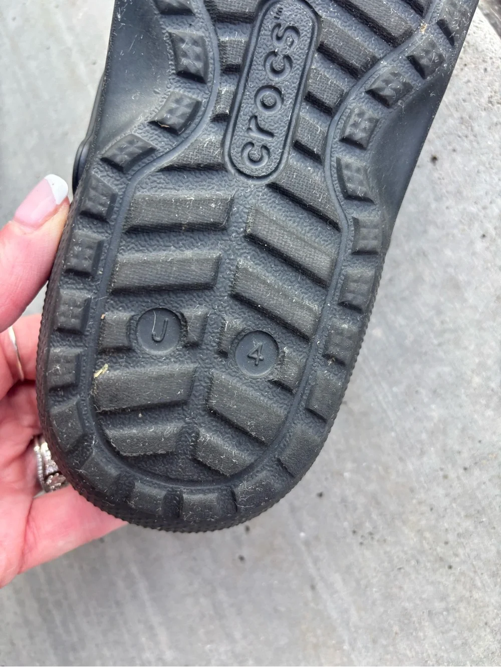 These are black lined classic black CROC Clogs featuring holiday Jibbitz charms